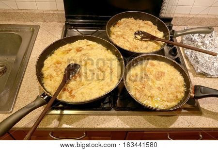 Three Large Pots With The Typical Dish Called Frico Of The Itali