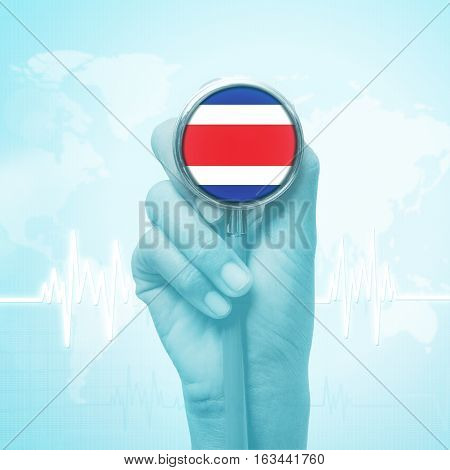 hand holding stethoscope with Costa Rica flag.
