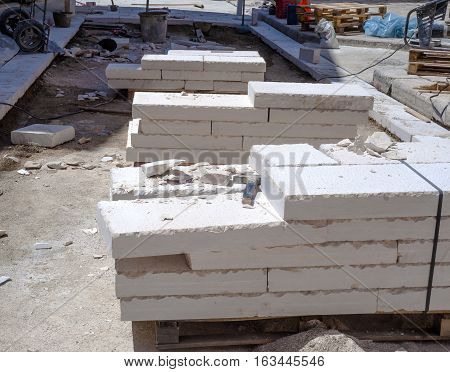 site area for the urban street pavement with limestone slabs. Featured pallets with limestone slabs work