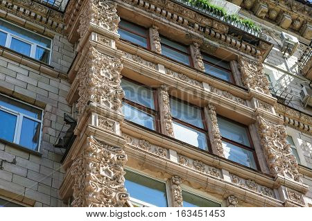 multi-story historic building with windows in city