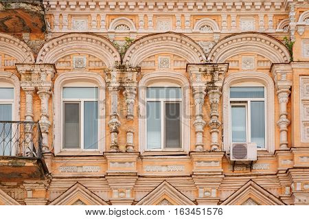 multi-story historic building with windows in city