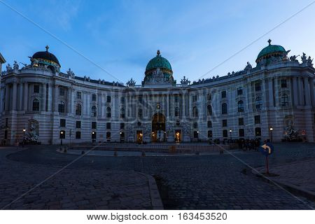Famous hofburg palace in vienna in the evening, seen from michaelerplatz, austria