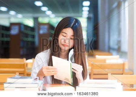 Happy Student Women Sittng On Wood Chair Light From Window For Reading Books