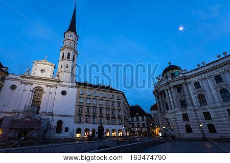 Famous hofburg palace and church in vienna in the evening seen from michaelerplatz austria