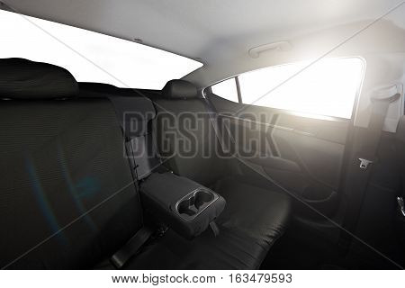 Cloth back black seat of modern sedan car with isolated windows