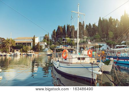 Colorful fishing boats docked in the harbor of Kalami Corfu island Greece