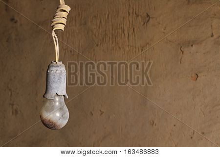 old burnt bulb against a background cracked wall, Breakage, old, decay, abandoned house