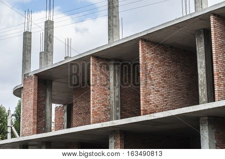 The upper floor of the brick house with a floor slab and piles