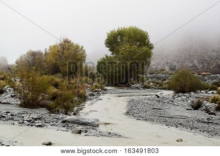 Water flowing through a flood wash after a heavy rainfall taken at the desert in Whitewater, CA