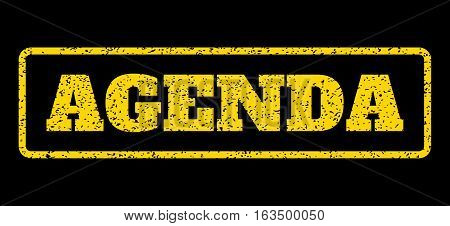 Yellow rubber seal stamp with Agenda text. Vector message inside rounded rectangular banner. Grunge design and scratched texture for watermark labels. Horisontal sticker on a blue background.