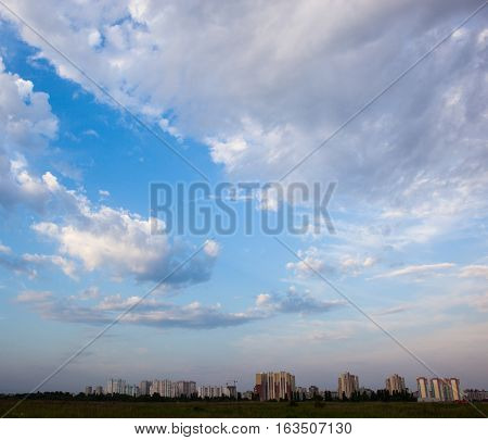 Urban landscape. Kyiv (Ukraine) high-rise buildings and cloudy sky.