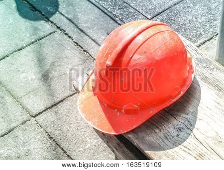 Yellow helmet standing on concrete roadside at construction site