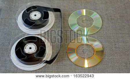 film VHS tapes and CDR discs on a gray background