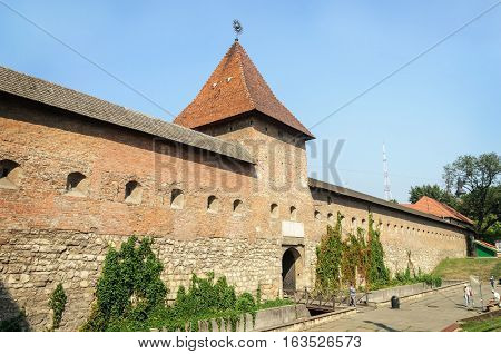 Lviv Ukraine - September 08 2016: Fortress wall (16-17 centuries) and Hlyniany Gate of Bernardine monastery