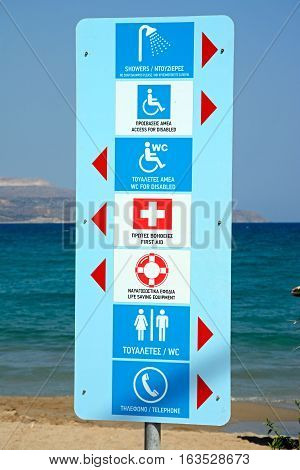 Facilities sign on the edge of the beach Kalyves Crete Greece Europe.
