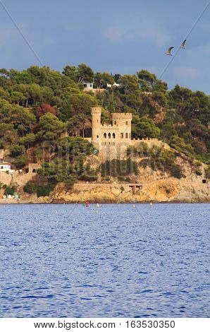 Castell d'en Plaja situated at the end of the Sa Caleta beach in Lloret de Mar, Costa Brava, Spain