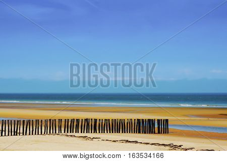 Beautiful Sand Dune with Blue Sky and Pretty Fence