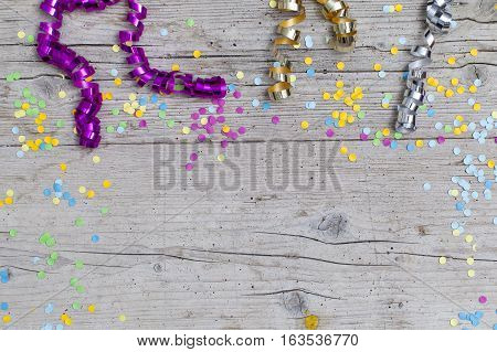 Carnival Confetti On Wood Background