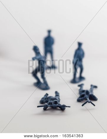 Blue plastic toy soldiers on white background