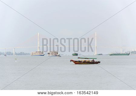 My Tho, Vietnam - February 14: Boat With Soil Floating On Mekong With Rach Mieu Bridge On February 1