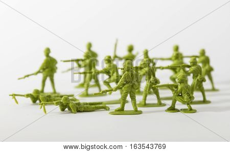 Green plastic toy soldiers with white background