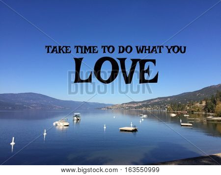 Lake landscape with inspirational quote on clear blue sky over mountains and calm water in summer.  Recreational boats anchored on lake and mountain reflections on water.  Instagram effects.
