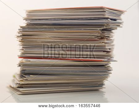 Pile of different business cards isolated on white background