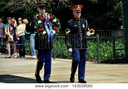Arlington Virginia - Apro;l 12 2014: Two U.S. Marines changing the floral wreath ceremony at the Tomb of the Unknown Soldier in Arlington National Cemetery