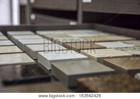 Kitchen and bath counter stone samples, aligned in rows of different material, and colors to fit your ideal kitchen or bathroom.