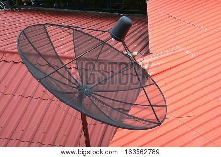 Satellite dish on the roof in rural village
