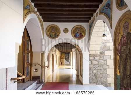 Kykkos Greece - November 24 2016: Cyprus island the sacred paintings and decorations of the Kykkos monastery courtyard porch