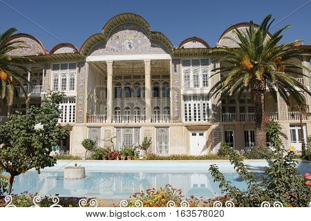 SHIRAZ, IRAN - OCTOBER 7, 2016: Beautiful palace within the Eram Garden on October 7, 2016 in Shiraz, Iran, Asia