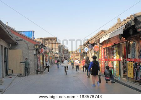 BEIJING CHINA - OCTOBER 26, 2016: Unidentified people visit Houhai lake Futong street.