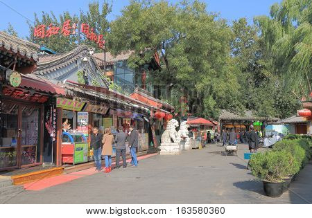 BEIJING CHINA - OCTOBER 26, 2016: Unidentified people visit Houhai lake Futong street.