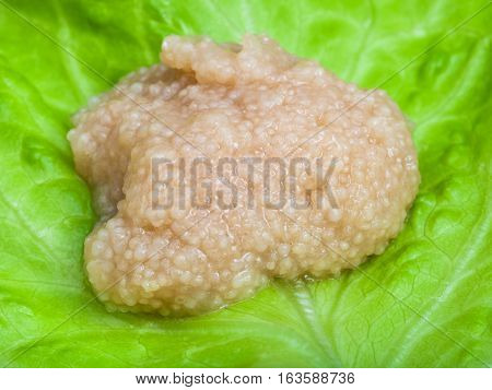 Salty Caviar Of Herring Fish On Green Leaf