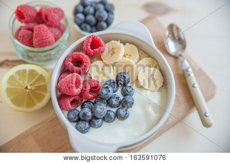 Healthy Yogurt with fresh fruit on a table