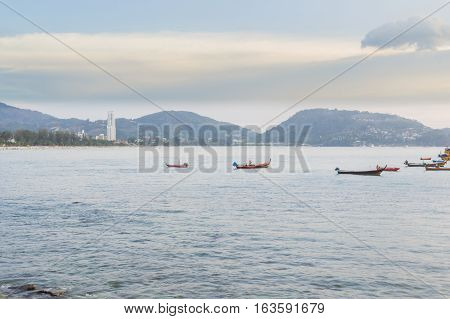 Patong beach on twilight cloudy Phuket Thailand. It is well-known destination for tourists all over the world.