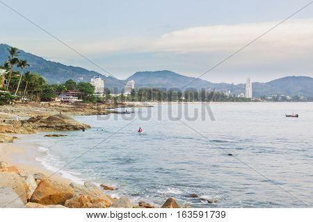 Kalim beach and Patong beach on twilight cloudy day Phuket Thailand. It is well-known destination for tourists all over the world.