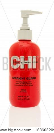 Winneconne WI - 21 December 2016: Bottle of CHI straight guard smooting styling cream on an isolated background.