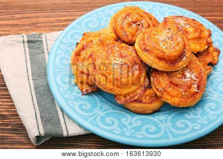 Puff pastry rolls with ham and cheese. Food for parties. Snack.