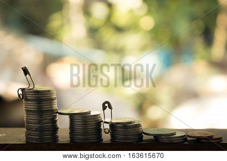 stack of coins with businessman on topconcept idea for business money and financail.