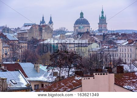 Evening Lviv. View of the central part of the city and churches: St. Michael's Ukrainian Catholic Church Church of the Holy Communion Korniakt Tower Armenian cathedral.