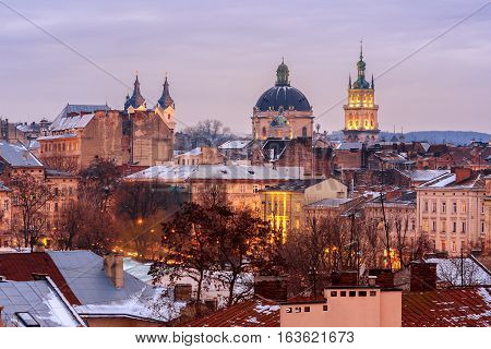 Evening Lviv. View of the central part of the city and churches: St. Michael's Ukrainian Catholic Church Church of the Holy Communion Korniakt Tower.