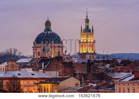 Evening Lviv. View of the central part of the city and churches: Church of the Holy Communion Korniakt Tower.