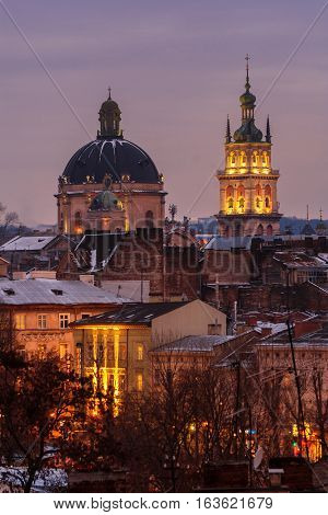 Evening Lviv. View of the central part of the city and churches: Church of the Holy Communion Korniakt Tower.