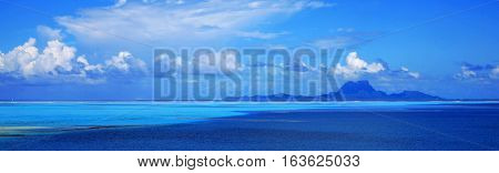 Panoramic view of Bora Bora island in Tahiti from off the coast of Taha'a.