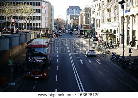 COLOGNE, GERMANY - NOVEMBER 24: A bus for city sightseeing stands in the lively Trank-Lane near the Cologne Cathedral on November 24, 2016 in Cologne.