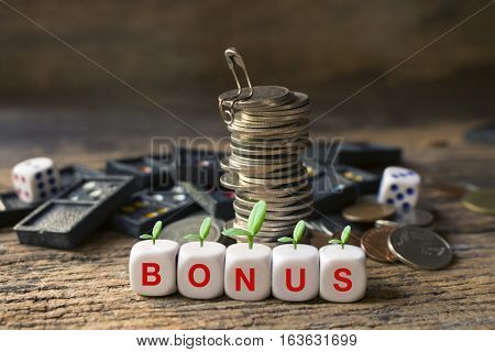 strack of coins and wording bonus concept idea for business