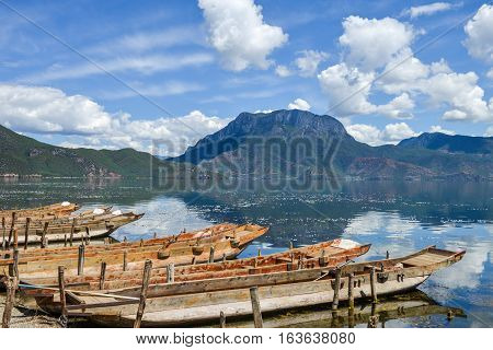 Boats anchored at wharf of Daluoshui village, beautiful scenery of Lugu Lake, Lijiang, China
