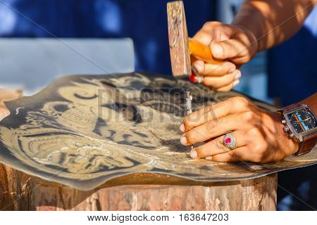 BANGKOK, THAILAND - JANUARY 14 2016: Making of Thail Traditional Shadow Puppet in the celebration of Thai Traditional Culture Festival at Lumpini Park